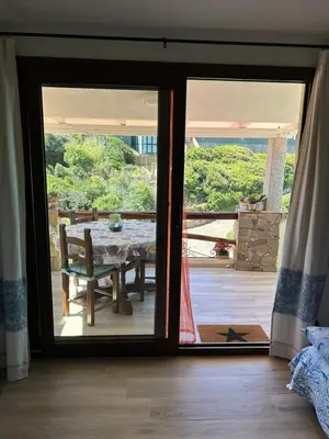 Balcone o terrazza di Oasi del Relax - Seaside Peaceful Panoramic Terrace in ITALY - new Sardinia apartment 50 mt beach&sea full comfort air conditioning-WiFi-Parking-Privacy