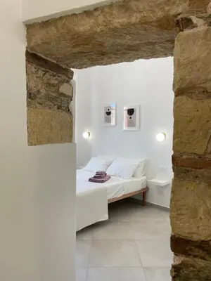Letto o letti in una camera di Dimora Taturì