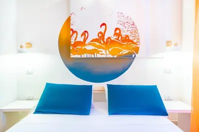 Letto o letti in una camera di Sunscape Rooms Cagliari City Center