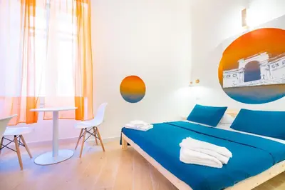 Letto o letti in una camera di Sunscape Rooms Cagliari City Center