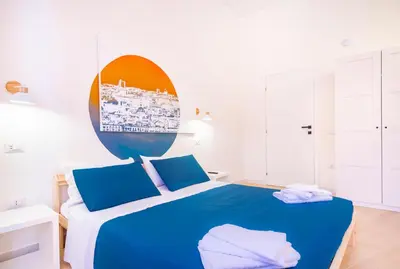 Letto o letti in una camera di Sunscape Rooms Cagliari City Center
