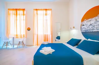 Letto o letti in una camera di Sunscape Rooms Cagliari City Center