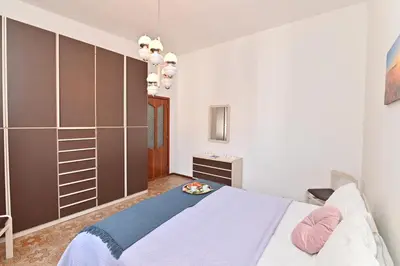 Letto o letti in una camera di IzzHome Coloniale