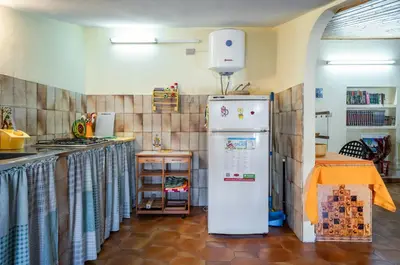 Cucina o angolo cottura di GuestHost - Torre di Calasetta Cozy Apartment