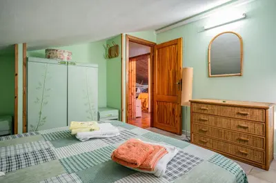 Letto o letti in una camera di GuestHost - Torre di Calasetta Cozy Apartment