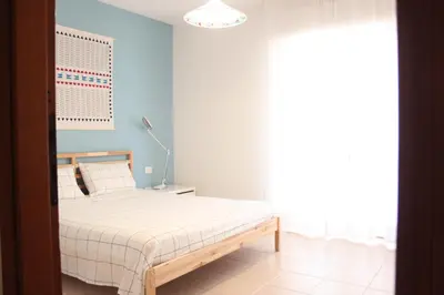 Letto o letti in una camera di Tuvixeddu Apartment - Cagliari