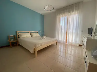 Letto o letti in una camera di Tuvixeddu Apartment - Cagliari
