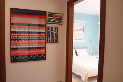 Letto o letti in una camera di Tuvixeddu Apartment - Cagliari