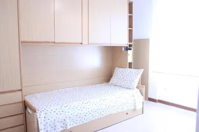 Letto o letti in una camera di Tuvixeddu Apartment - Cagliari