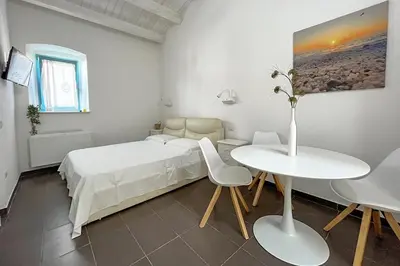 Letto o letti in una camera di B&B Dimora Orrù