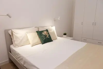 Letto o letti in una camera di Estia Suites