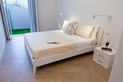 Letto o letti in una camera di Estia Suites