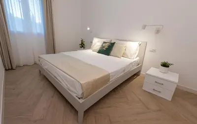 Letto o letti in una camera di Estia Suites