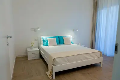 Letto o letti in una camera di Estia Suites