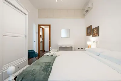 Letto o letti in una camera di Greta House San Benedetto