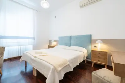 Letto o letti in una camera di Greta House San Benedetto