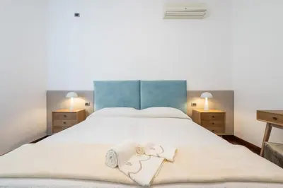 Letto o letti in una camera di Greta House San Benedetto