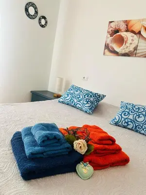 Letto o letti in una camera di Le petunie apartments