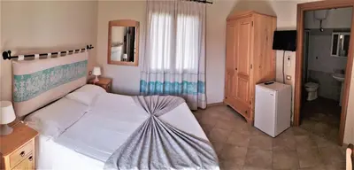 Letto o letti in una camera di Meravisola Costa Rei Holiday Rooms