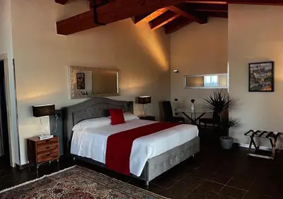 Letto o letti in una camera di Vi Ja Villa Janas Cagliari Resort