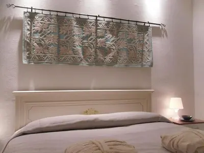 Letto o letti in una camera di B&B Fragus e Saboris de Sardigna