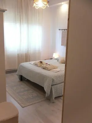 Letto o letti in una camera di B&B Fragus e Saboris de Sardigna