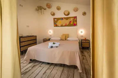 Letto o letti in una camera di Tiliguerta Glamping&Camping Village
