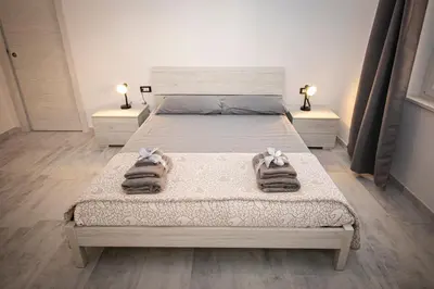 Letto o letti in una camera di Casa LoiS