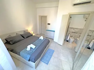 Letto o letti in una camera di Camere in Centro