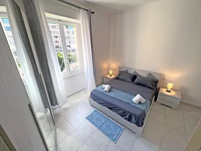 Letto o letti in una camera di Camere in Centro