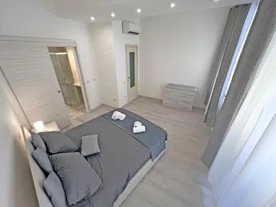 Letto o letti in una camera di Camere in Centro