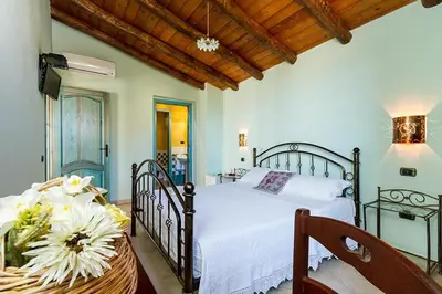 Letto o letti in una camera di B&B Sa Specula IUN E4404