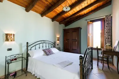 Letto o letti in una camera di B&B Sa Specula IUN E4404