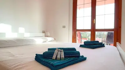 Letto o letti in una camera di Casa Ambra - Villetta con vista, giardino e BBQ