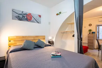 Letto o letti in una camera di 'Al Vico Dante'