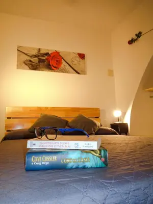 Letto o letti in una camera di 'Al Vico Dante'