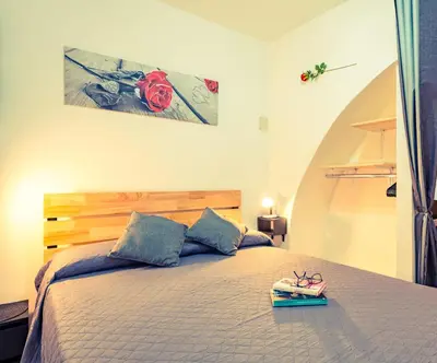 Letto o letti in una camera di 'Al Vico Dante'
