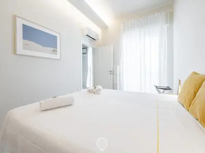 Letto o letti in una camera di Sleek City Oasis
