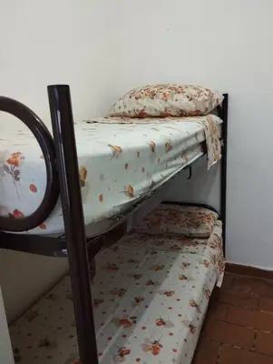 Letto o letti in una camera di casa vacanze Cettina home 2 mt 50 dal mare