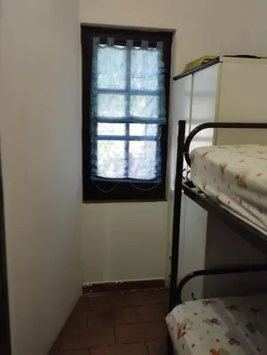 Letto o letti in una camera di casa vacanze Cettina home 2 mt 50 dal mare