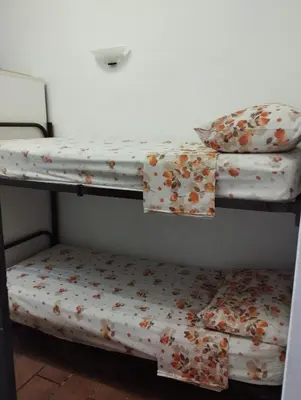 Letto o letti in una camera di casa vacanze Cettina home 2 mt 50 dal mare
