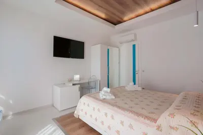 Letto o letti in una camera di Lumiere Rooms - Eja Sardinia