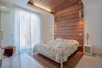 Letto o letti in una camera di Lumiere Rooms - Eja Sardinia