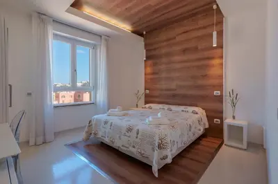 Letto o letti in una camera di Lumiere Rooms - Eja Sardinia