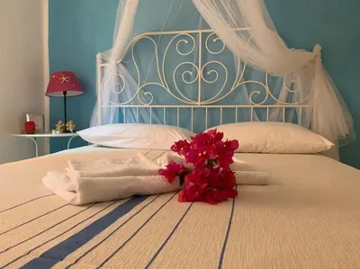 Letto o letti in una camera di Villa Cala Sinzias