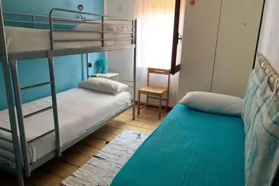 Letto o letti in una camera di Villa Cala Sinzias