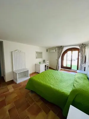 Letto o letti in una camera di Villa Malva Apartment