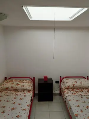Letto o letti in una camera di casa vacanze cettina home 3 mt 50 dal mare