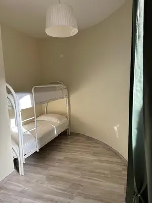 Letto o letti in una camera di Villa Blue Paradise Relax con piscina a pochi minuti da Cagliari e dal mare