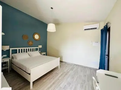 Letto o letti in una camera di Villa Blue Paradise Relax con piscina a pochi minuti da Cagliari e dal mare